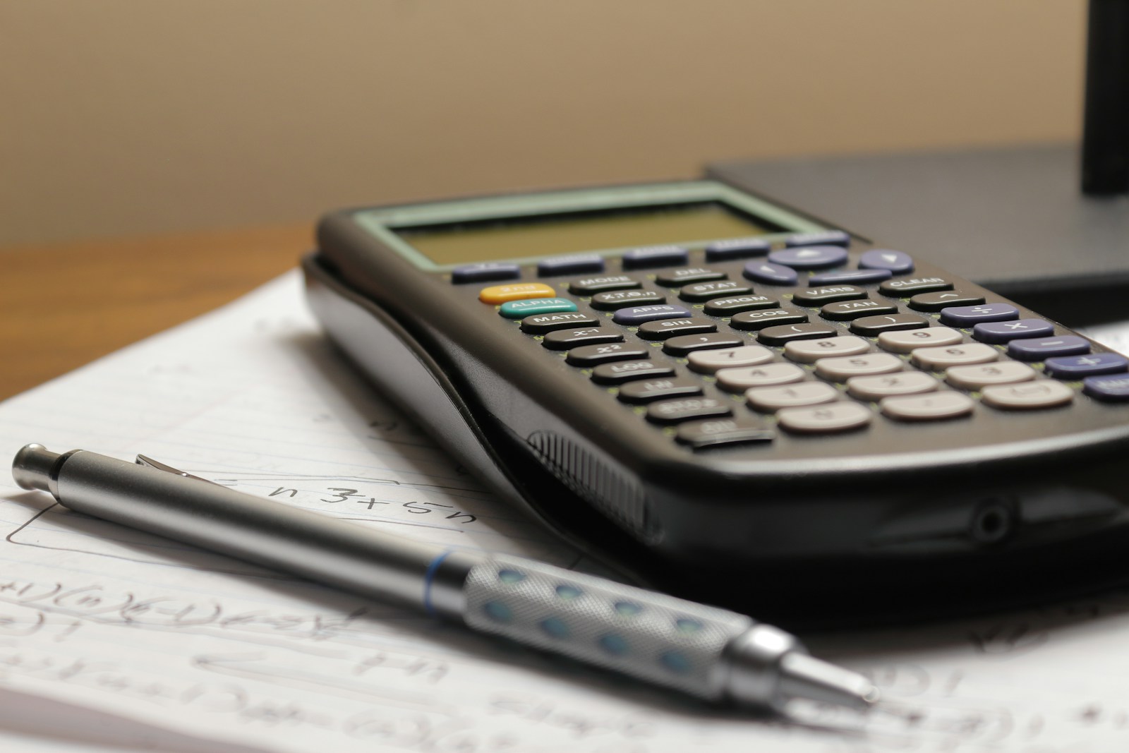 Calculator and paper on a desk; illustrative stock photograph